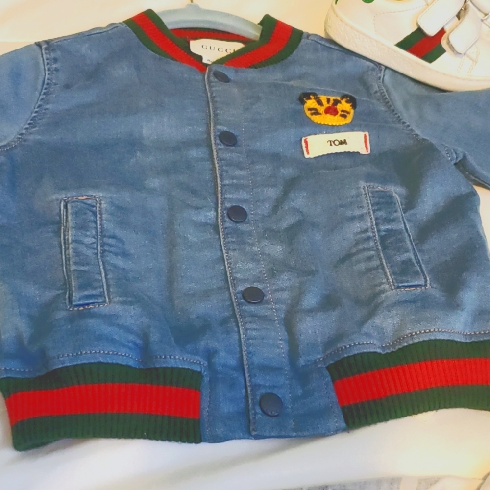 Sold OutGucci KidsBaby jersey denim bomber jacket with patch